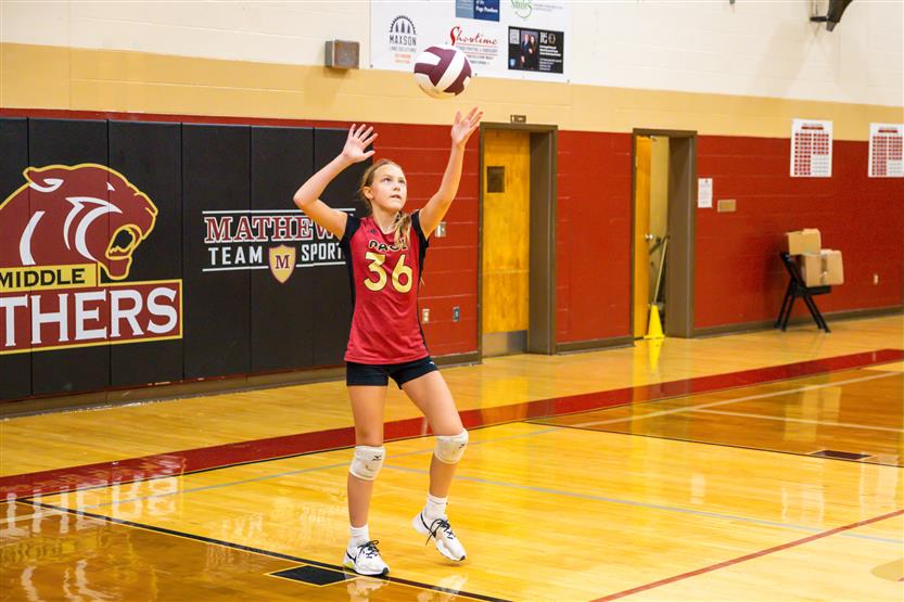 Student-athletes play volleyball